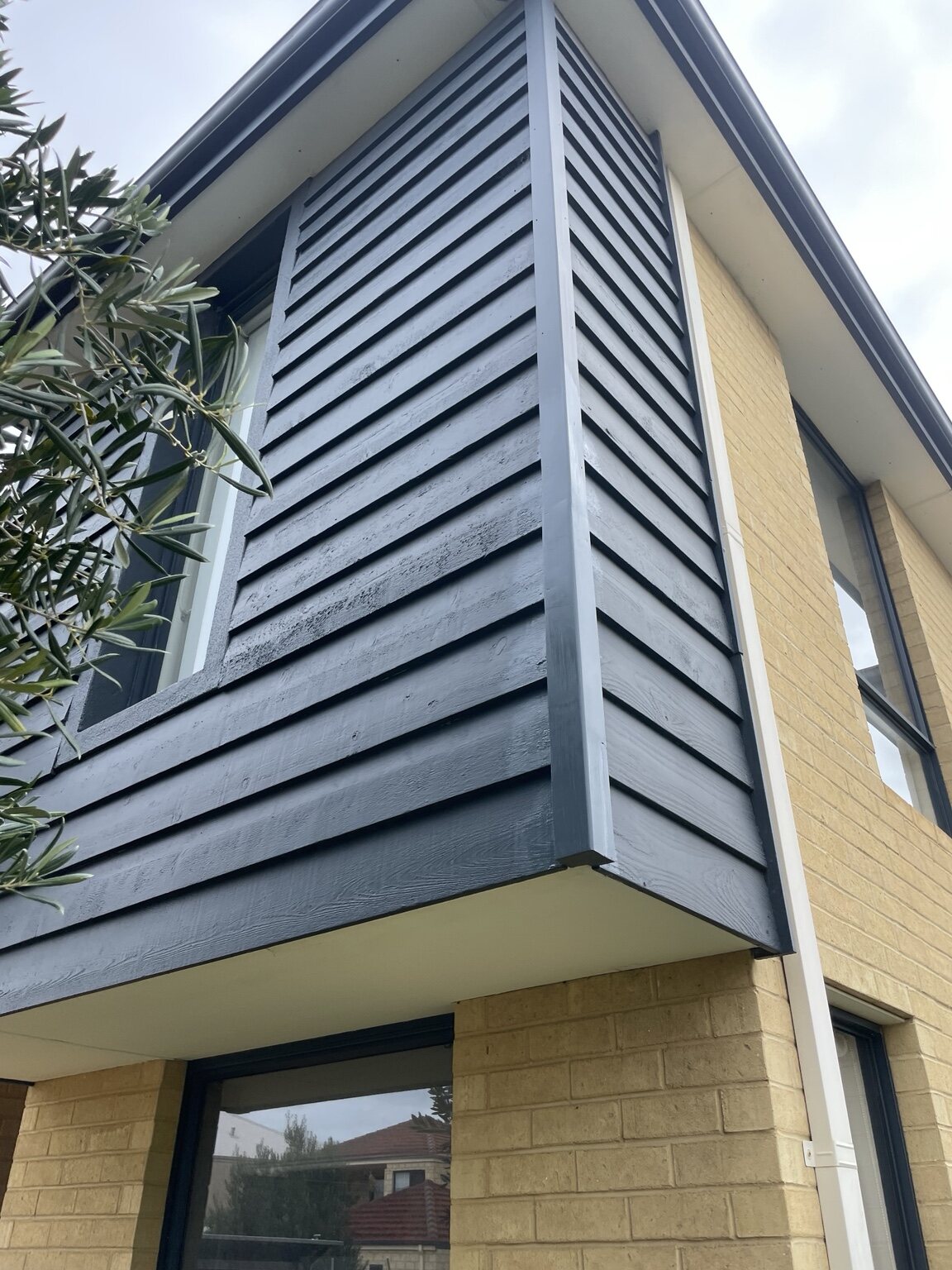 Exterior timber corner after HandMate repair and refinishing