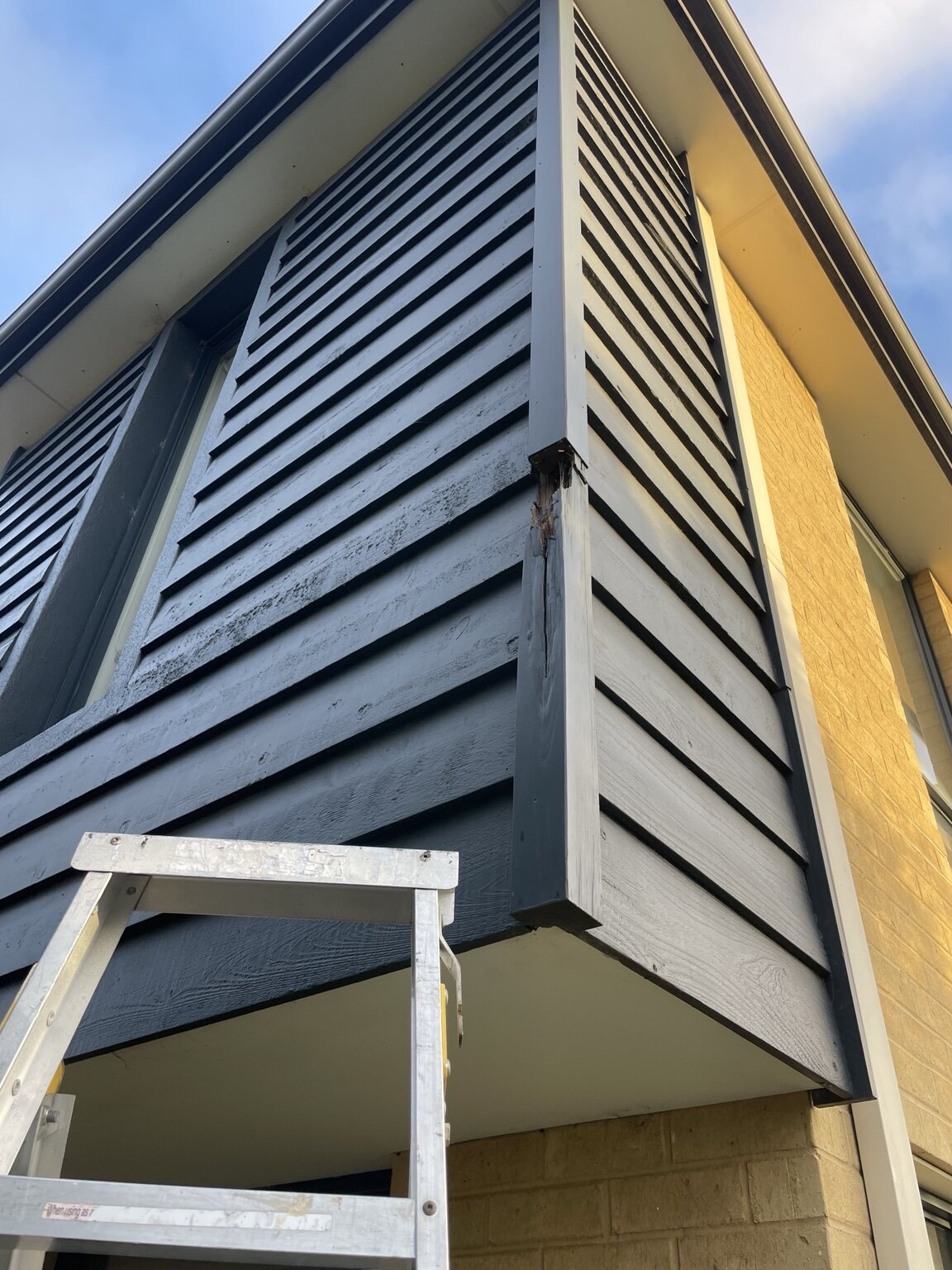 Damaged exterior timber corner before HandMate repair